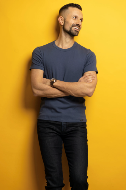 Justin John Moniz with yellow background